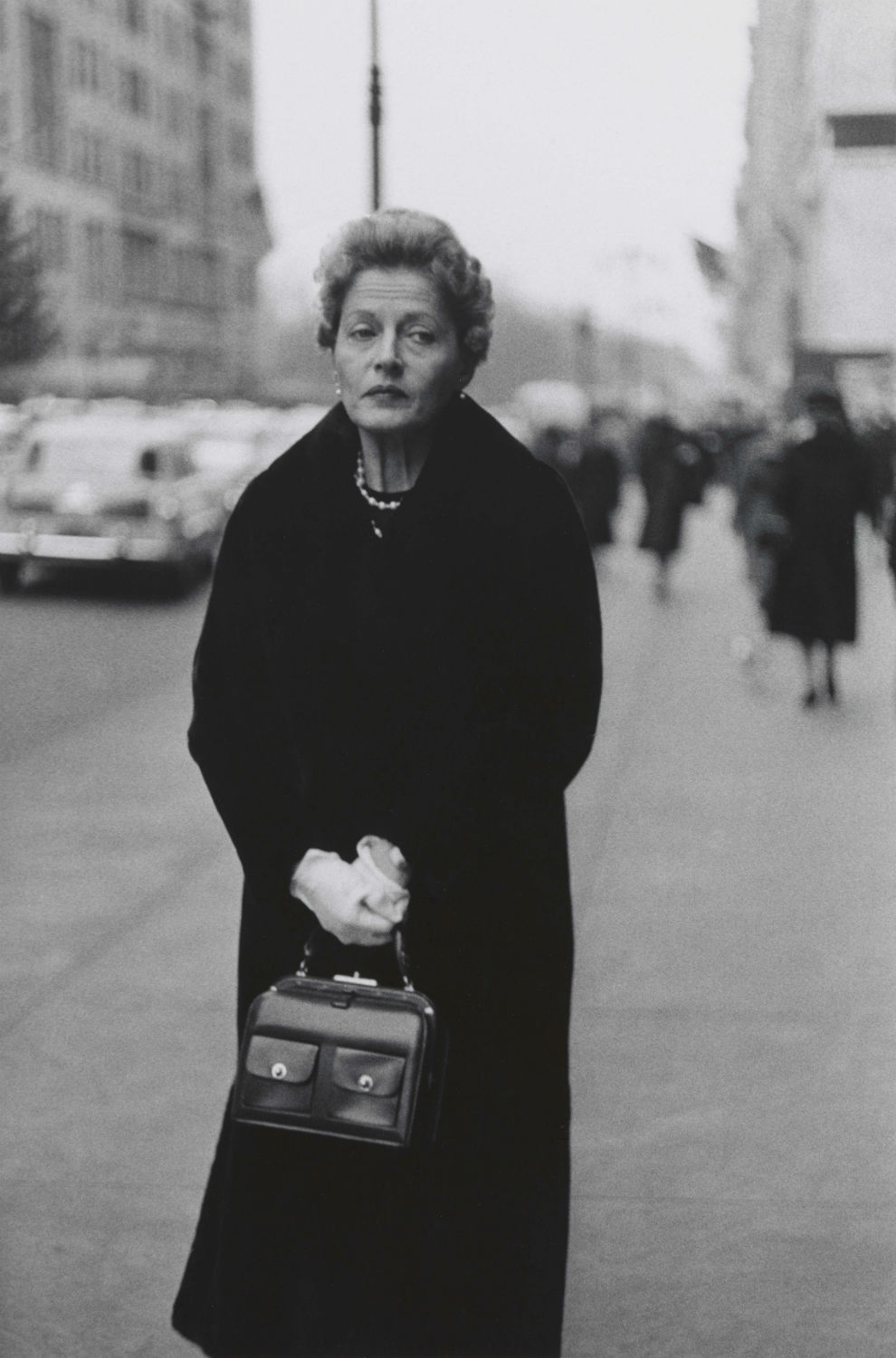 Woman with white gloves and a pocket book, N.Y.C. 1956