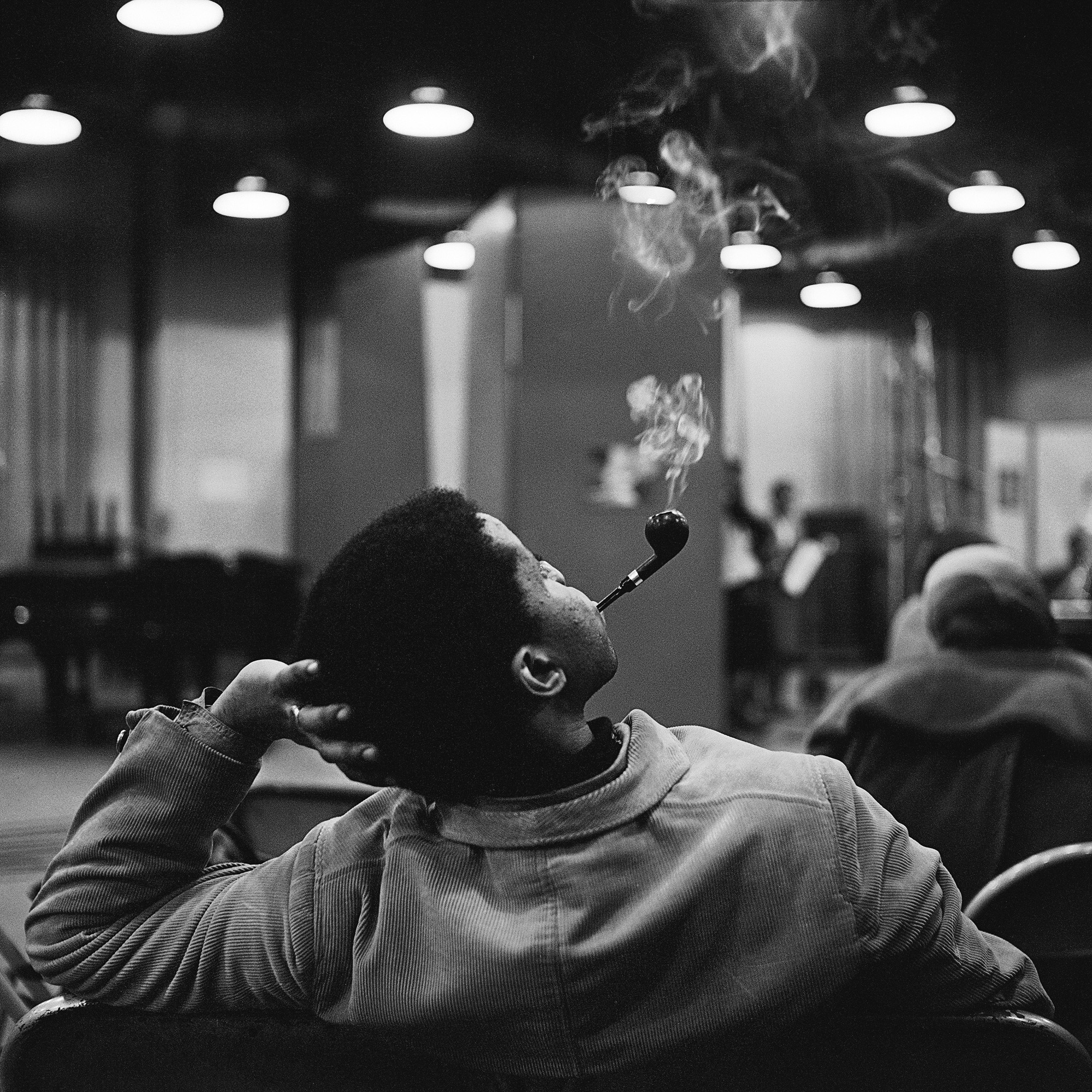 Man smoking in a ballroom