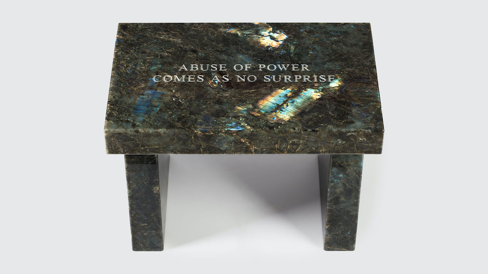 Jenny Holzer Selection from Truisms: Abuse of power..., 2015 Dark labradorite footstool 17 x 25 x 16 inches 43.2 x 63.5 x 40.6 cm     Edition 6 of 6, 1 AP  Inscribed     © Jenny Holzer, member Artists Rights Society (ARS), New York. Courtesy the artist