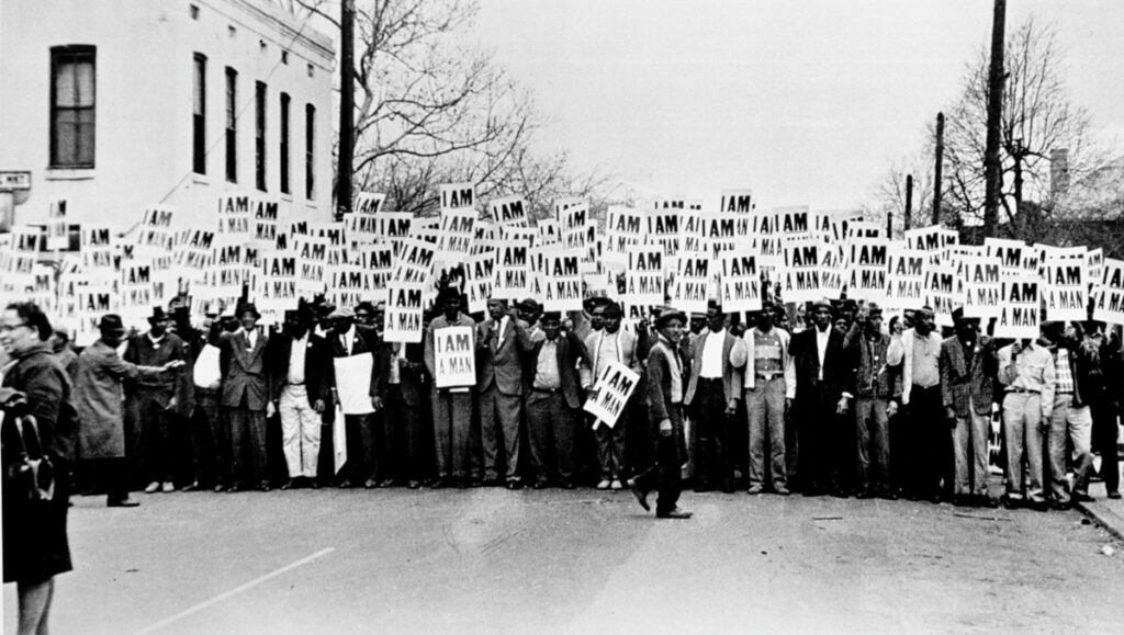 Ernest C. Withers (American, 1922–2007), Sanitation Workers assemble in front of Clayborn Temple for a solidarity march, Memphis, Tennessee, 1968, gelatin silver print, High Museum of Art, Atlanta, purchase with funds from the Director’s Circle, 2002.24.1.